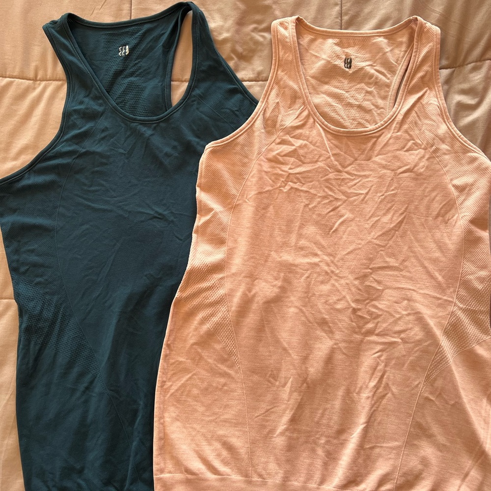 2 Sweaty Betty athlete seamless tanks, size large.